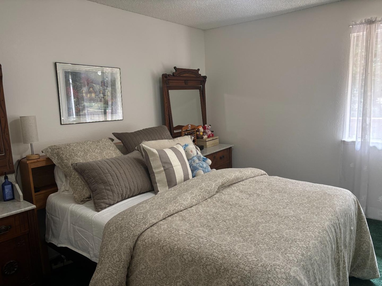 Bedroom with window and neutral finishes
